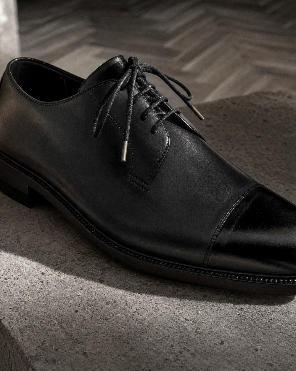 The Maison Derby, hand-burnished obsidian box-calf derby.